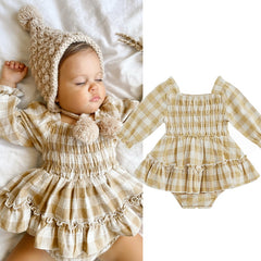 Nerida  - Gingham Ruched Long Sleeve Romper Nerida  - Gingham Ruched Long Sleeve Romper.